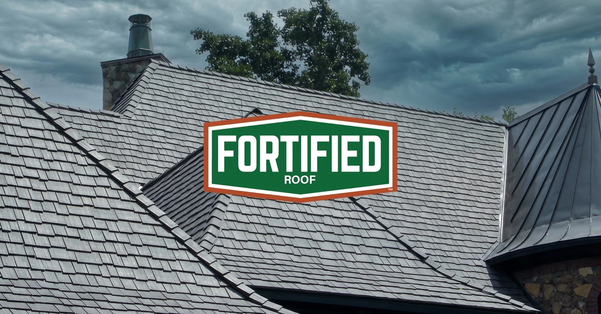 FORTIFIED Roof Approved Enviroshake composite cedar shake roofing on a large residential home.