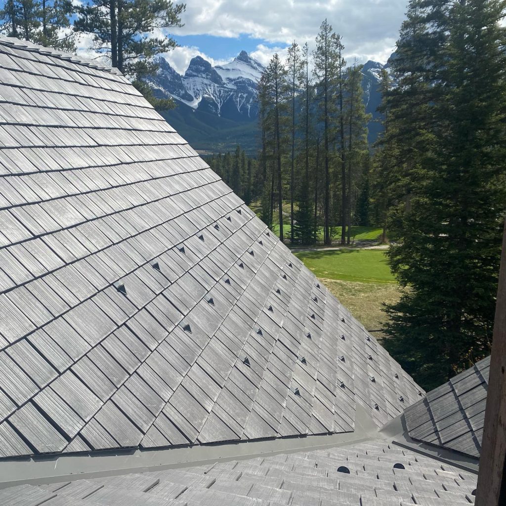 Enviroshake composite cedar roofing on a steep mountain roofline, with realistic cedar grain and natural weathered character