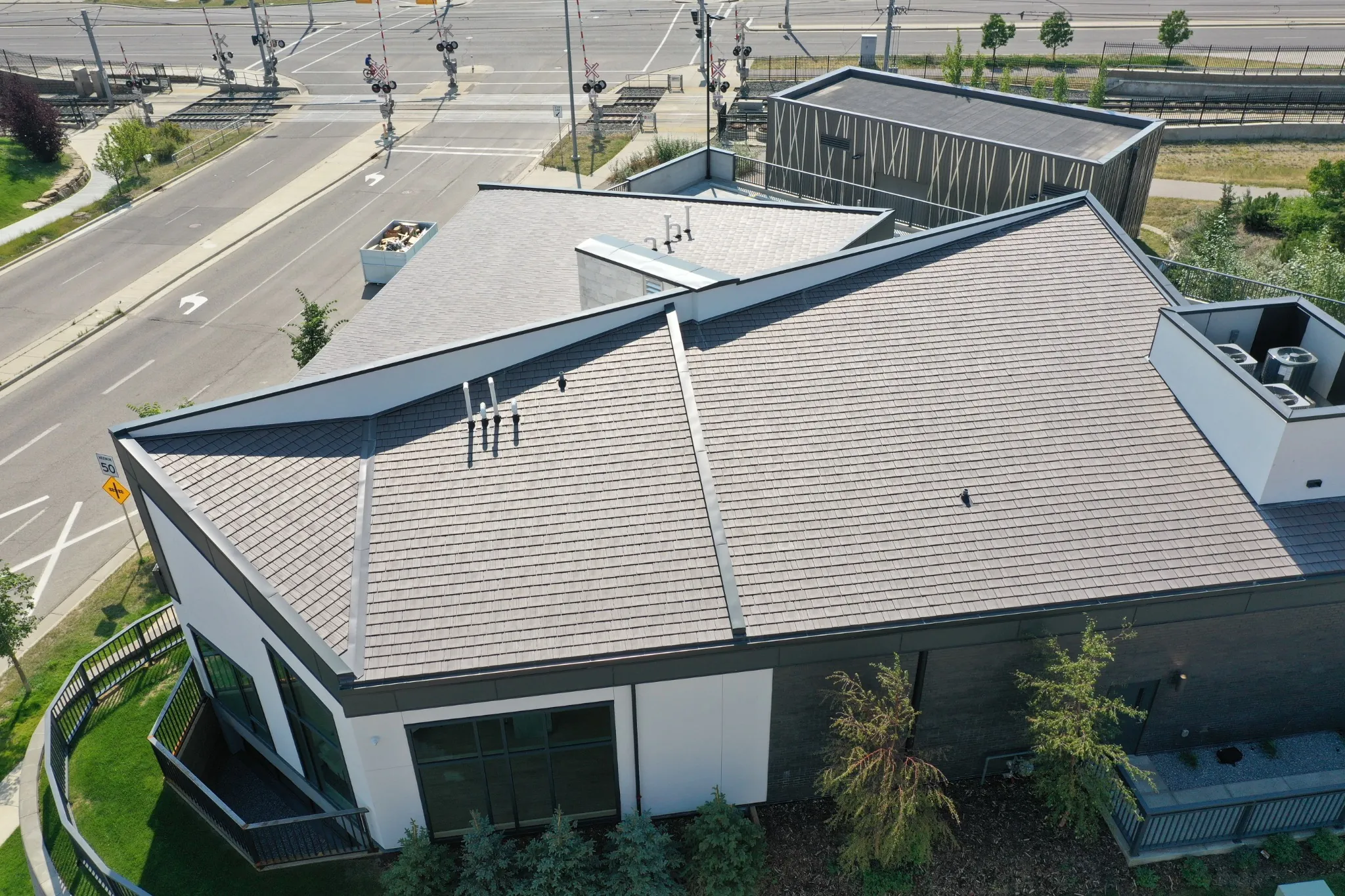 Aged Cedar Enviroshake composite cedar shake roofing on a modern medical center with contemporary architecture.