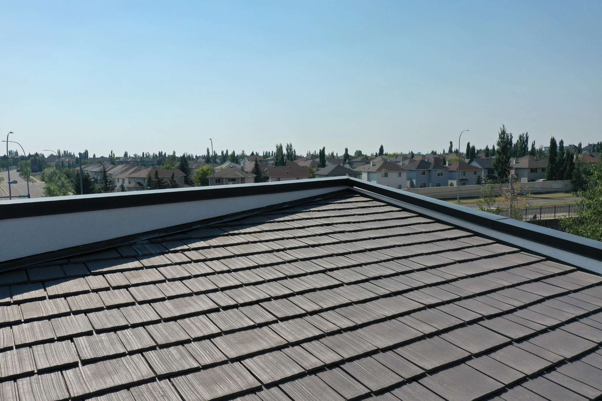 Aged Cedar Enviroshake composite cedar shake roofing on a modern medical center with contemporary architecture.