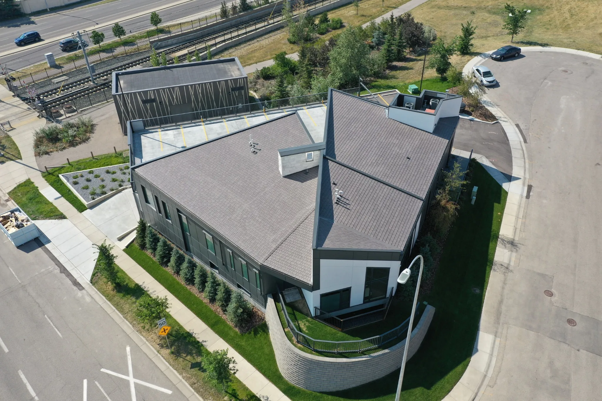 Aged Cedar Enviroshake composite cedar shake roofing on a modern medical center with contemporary architecture.
