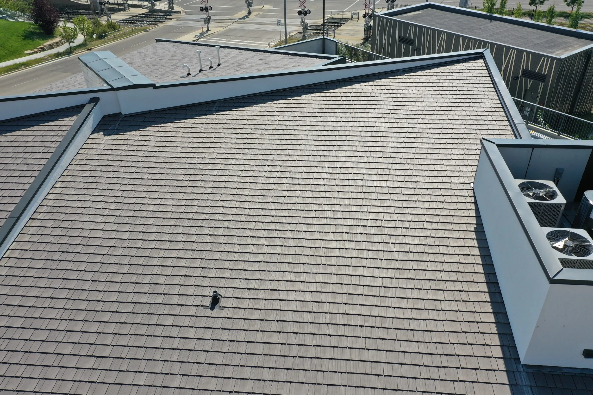 Aged Cedar Enviroshake composite cedar shake roofing on a modern medical center with contemporary architecture.