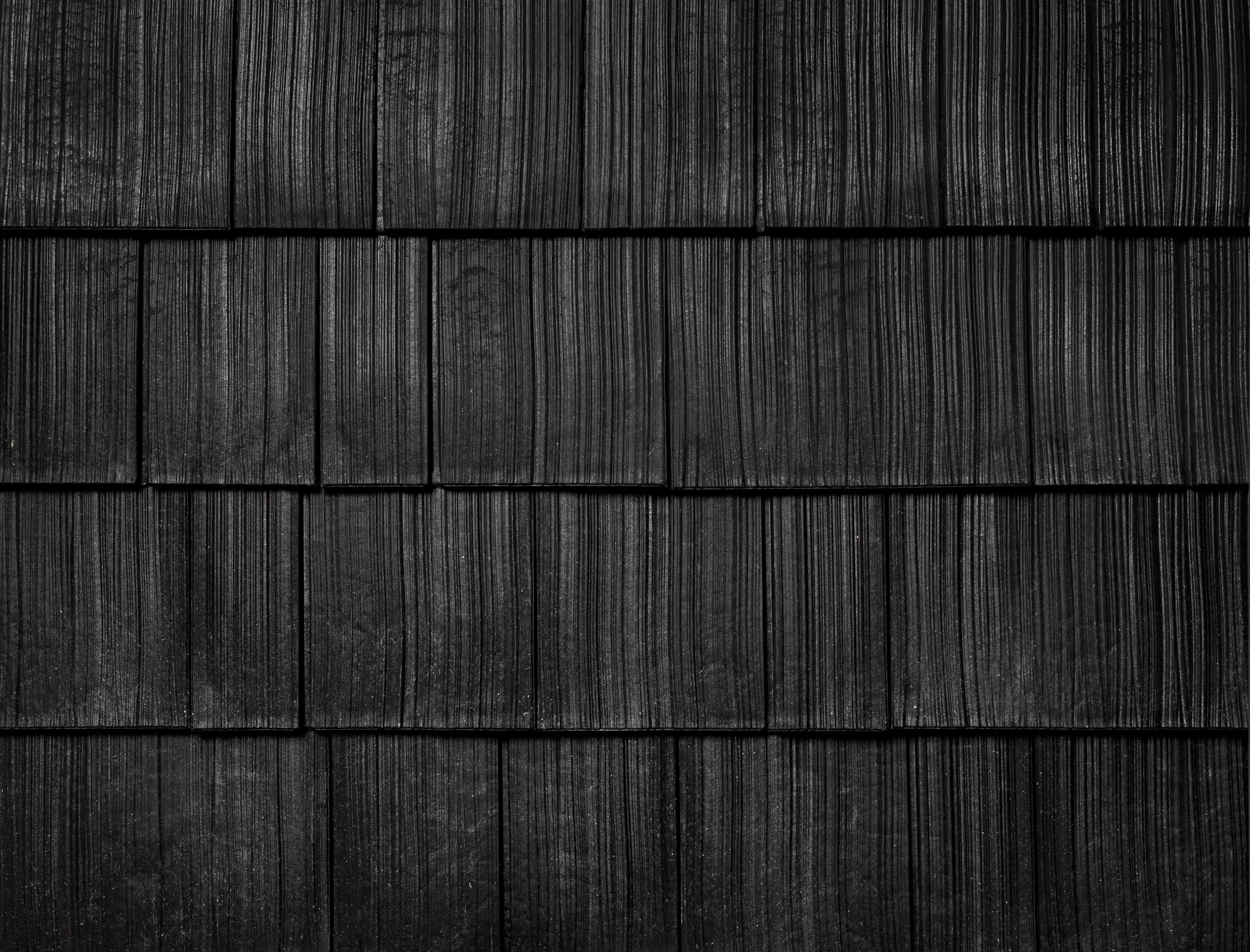 Onyx Black shake colour sample showing wood-grain texture in staggered rows.