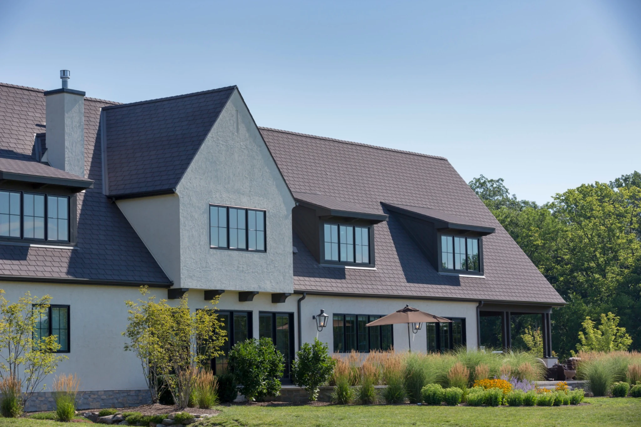 A luxury modern farmhouse with a premium Enviroslate roof in charcoal grey