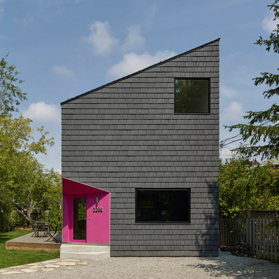 Enviroshake composite cedar roofing used as exterior wall cladding on a contemporary home, creating a clean, uniform shake façade with a distinctive modern profile.