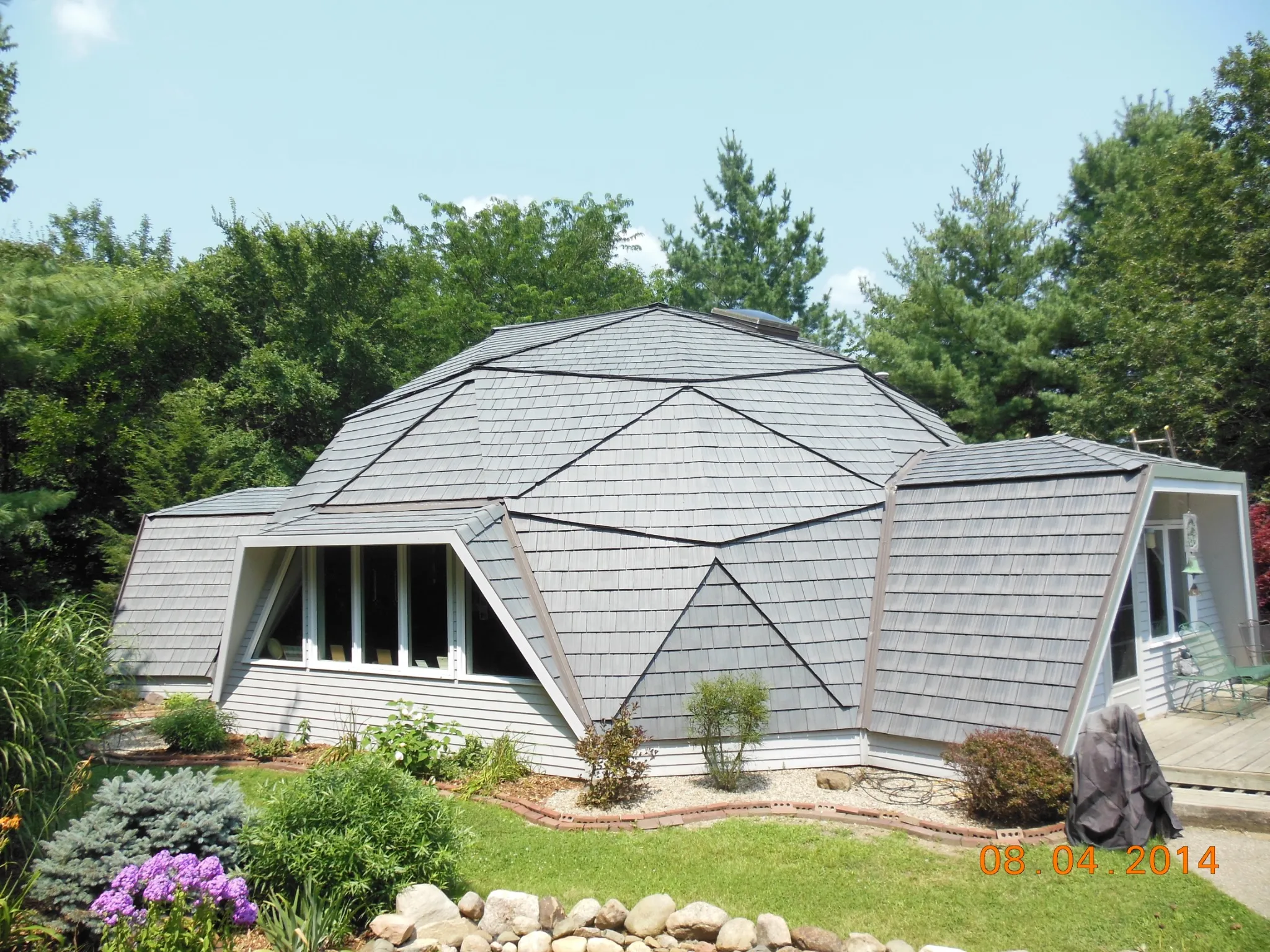 Silvered Cedar Enviroshake composite cedar shake roofing on a contemporary home with a distinctive multi-angled roof design.