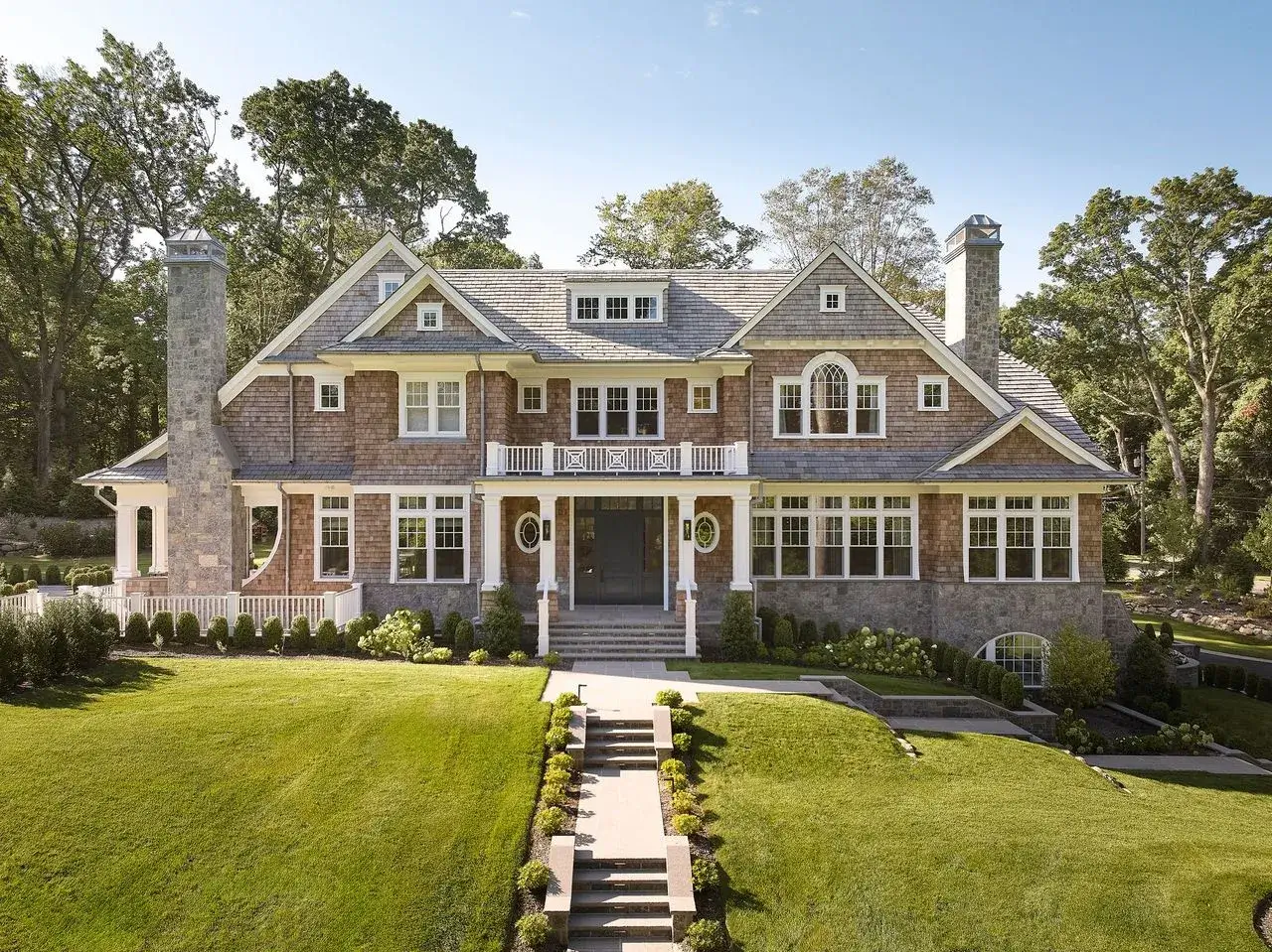 A Cape Cod style luxury home with cedar siding and Enviroshake roof tiles