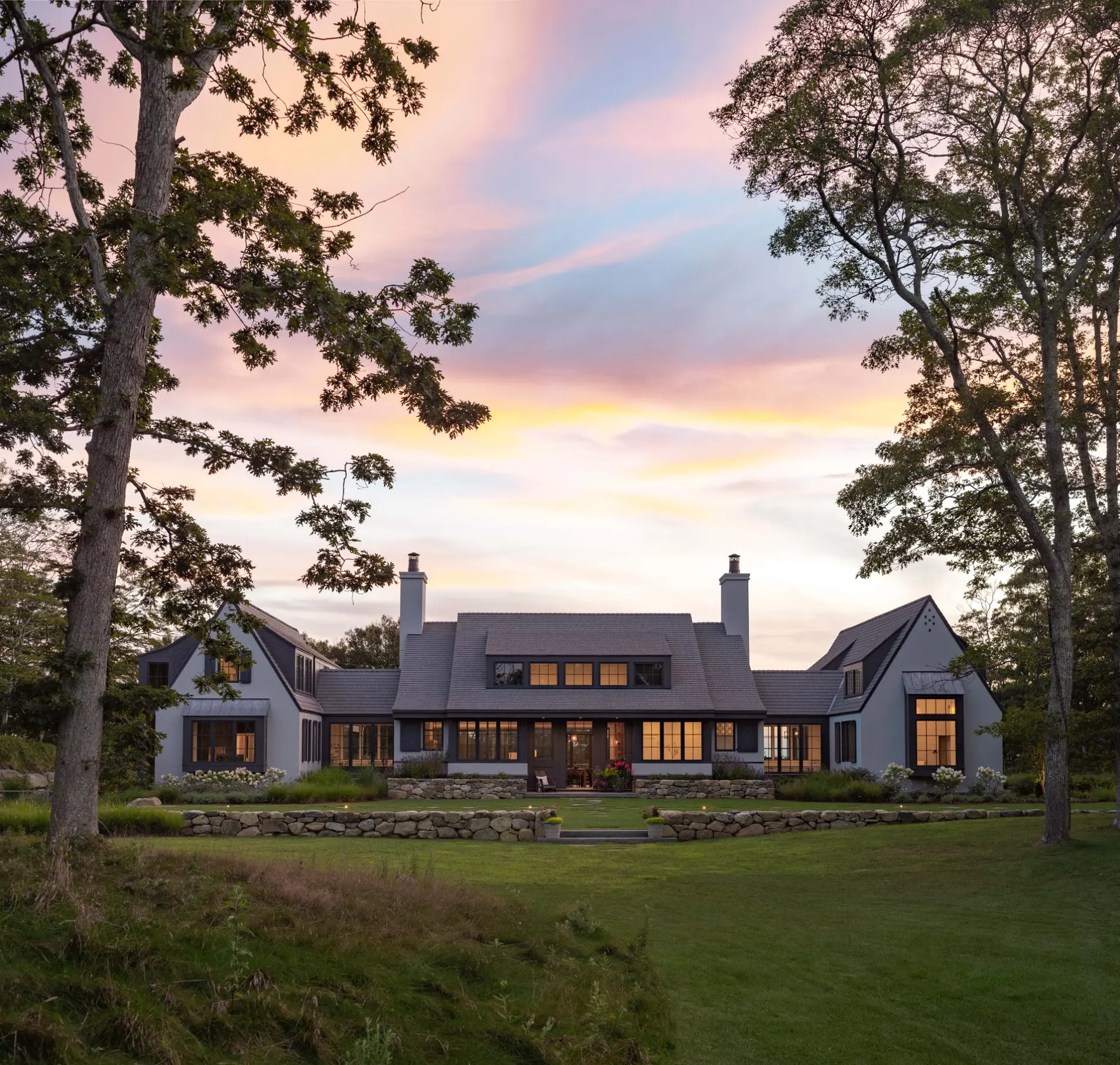 Lakeside home with an Enviroshake roof at sunset