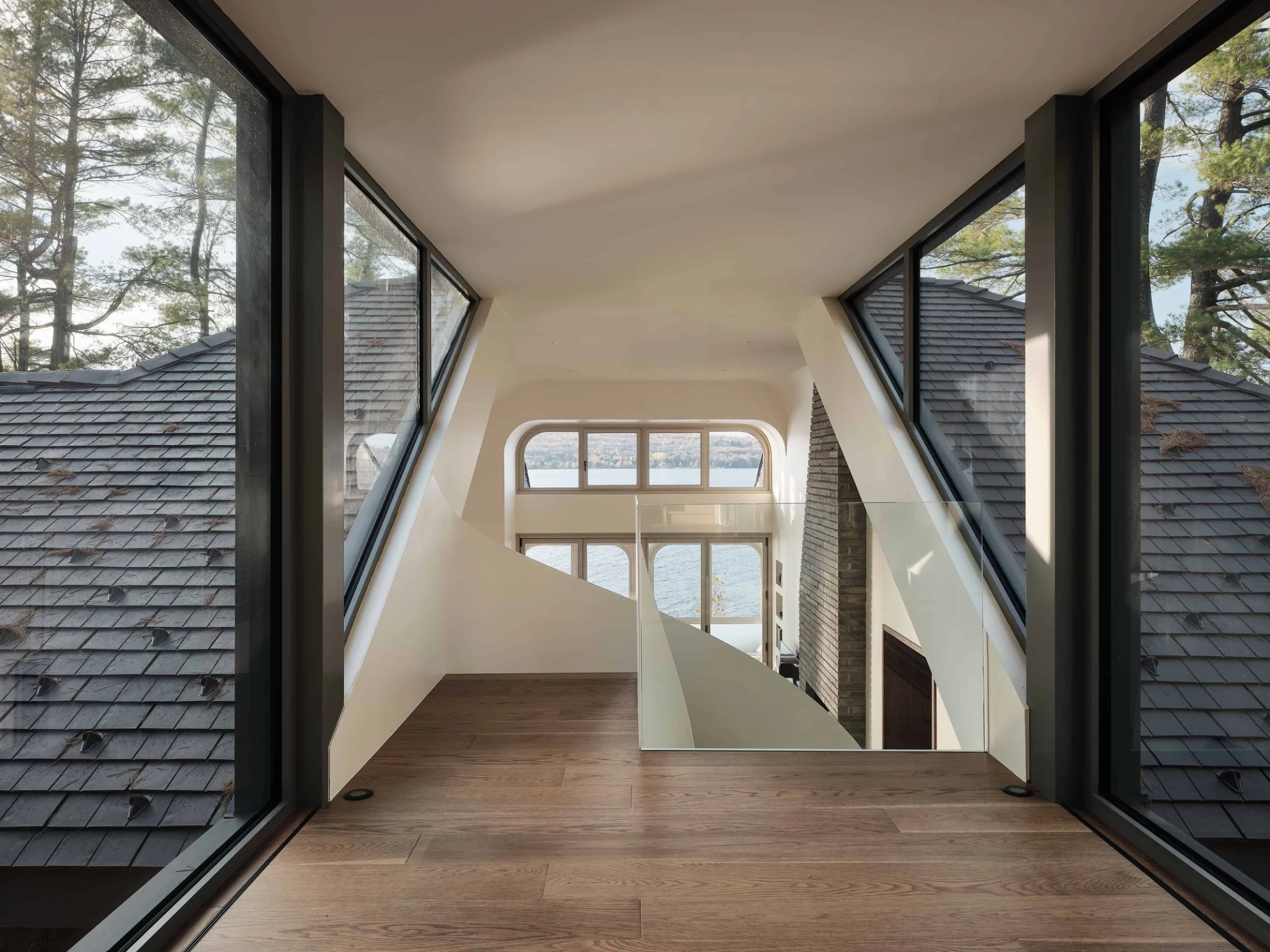 Interior glass walkway looking out over an Enviroshingle roof