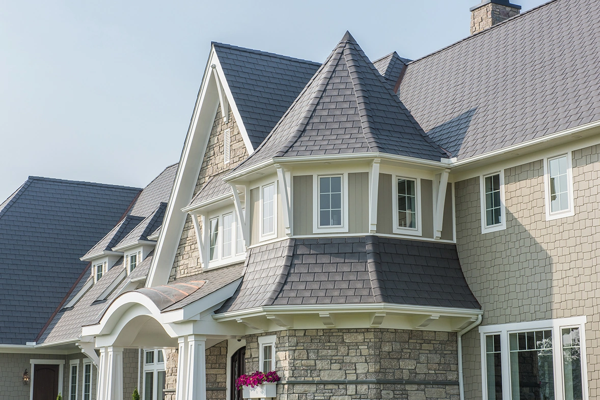 Home with an Enviroslate Charcoal Grey roof on a turret and gables