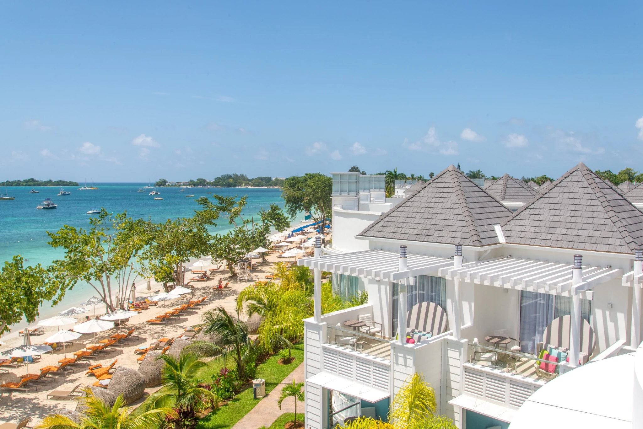 Aerial view of a beachfront resort with grey Enviroshake roofs in Jamaica