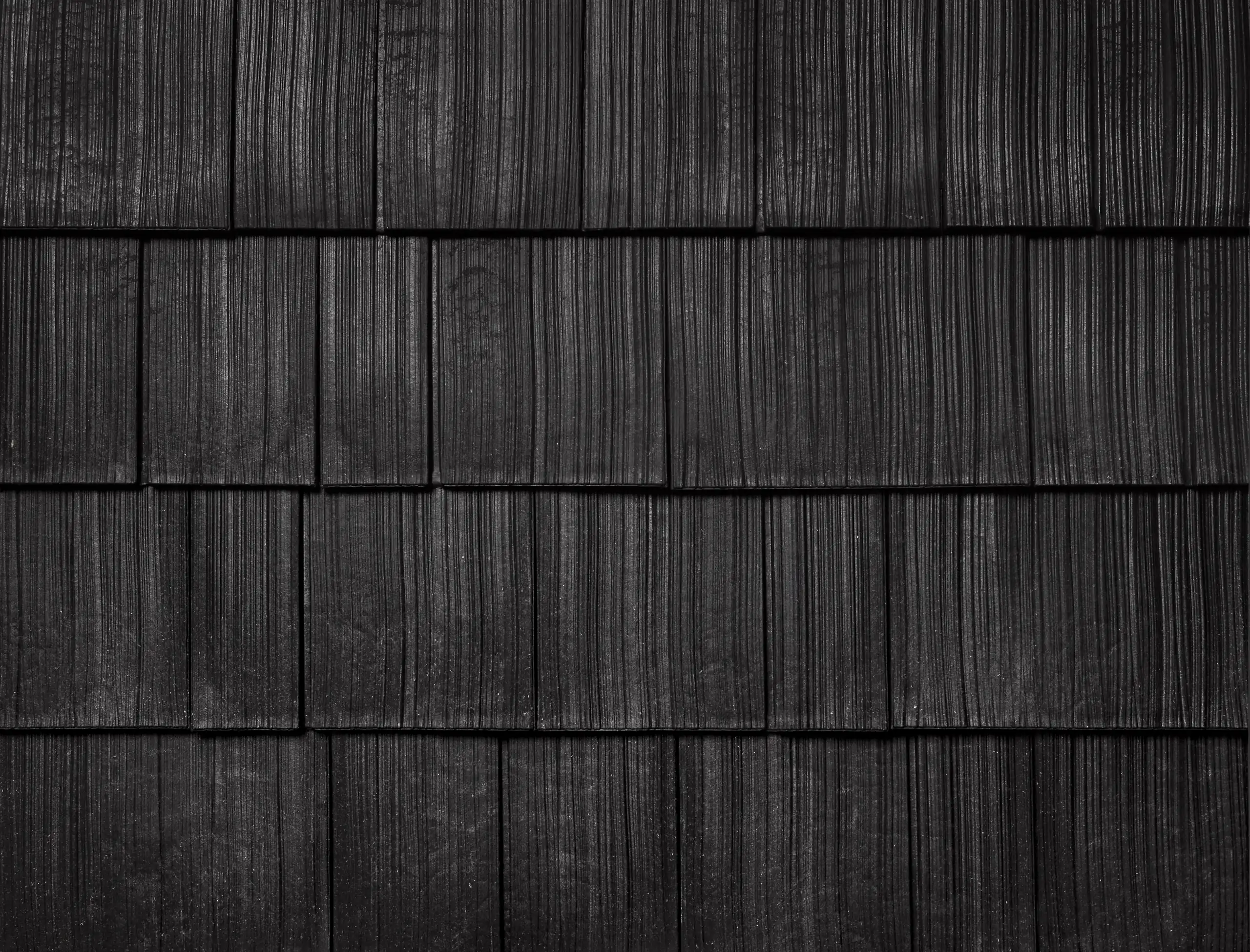 Onyx Black shake colour sample showing wood-grain texture in staggered rows.