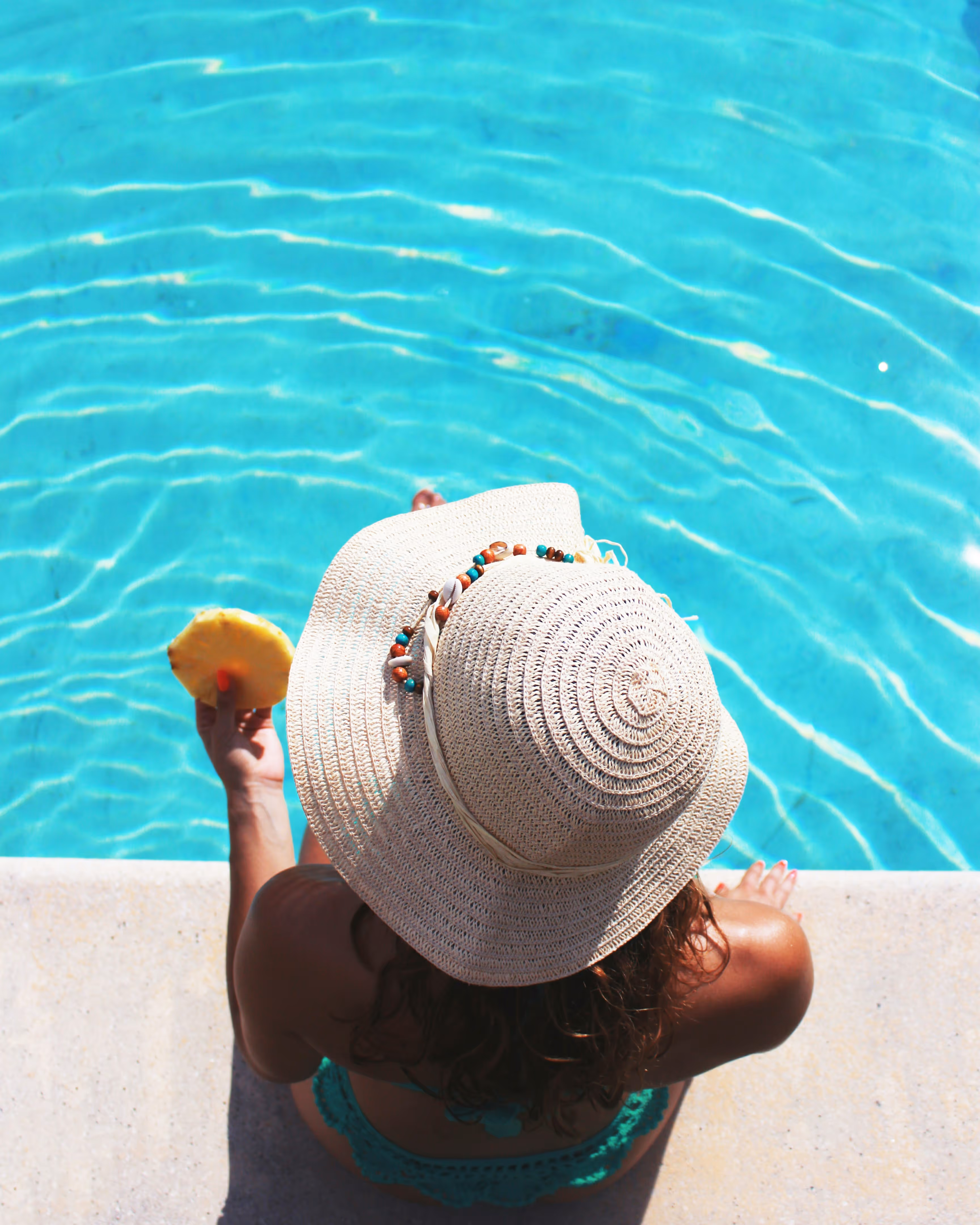 Woman sitting at the pool