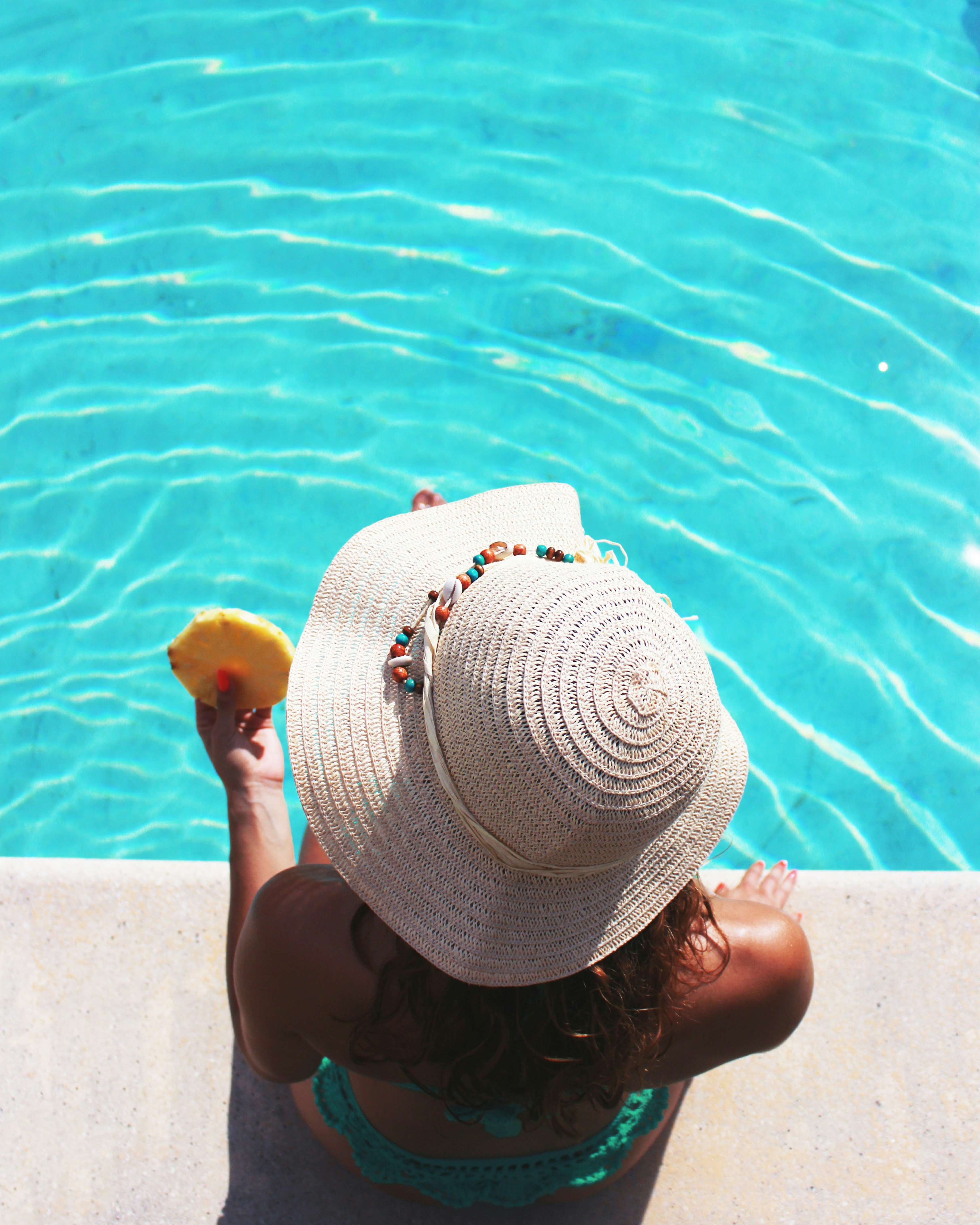Woman sitting at the pool