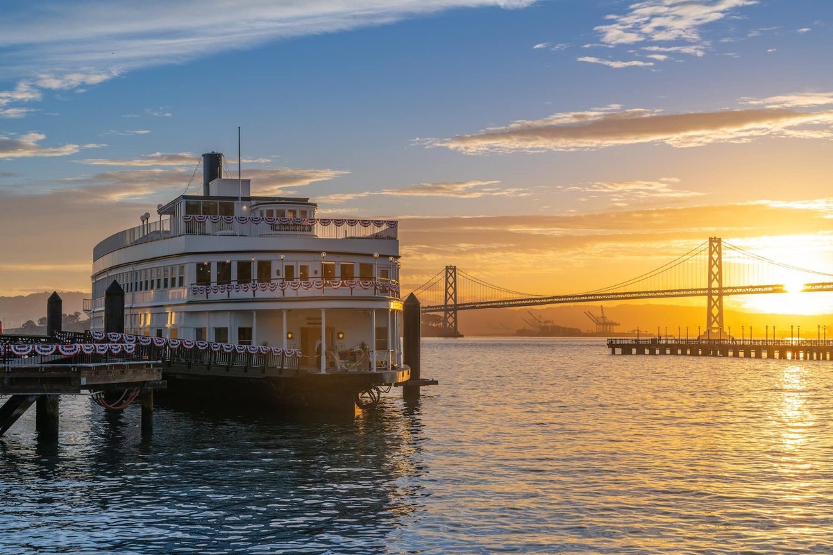 The Historic Klamath at Pier 9 at sunrise, with the Bay Bridge behind
