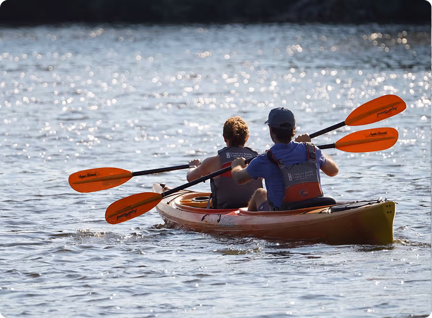 A couple of people that are in a kayak.