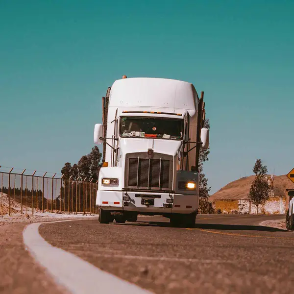 Semi truck driving down the highway
