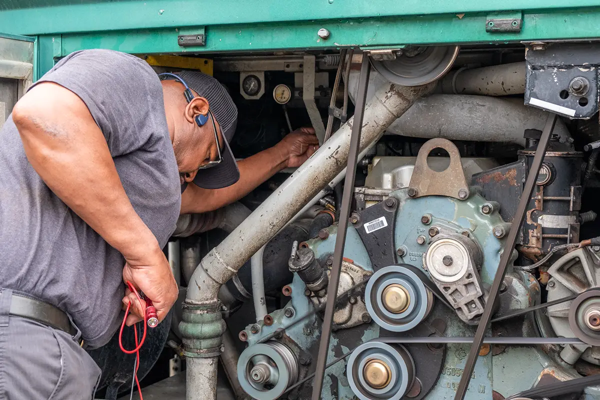 Mobile diesel mechanic performing truck repairs