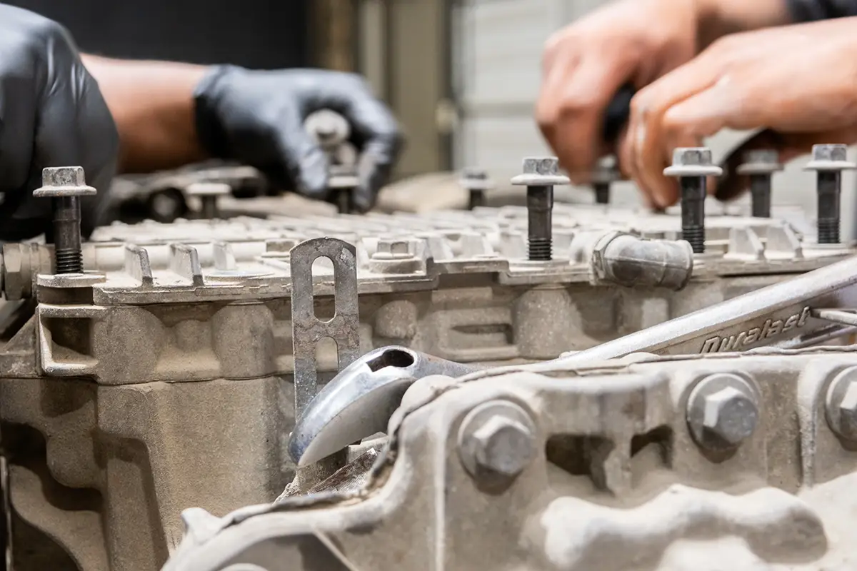 Diesel mechanic performing heavy equipment repairs