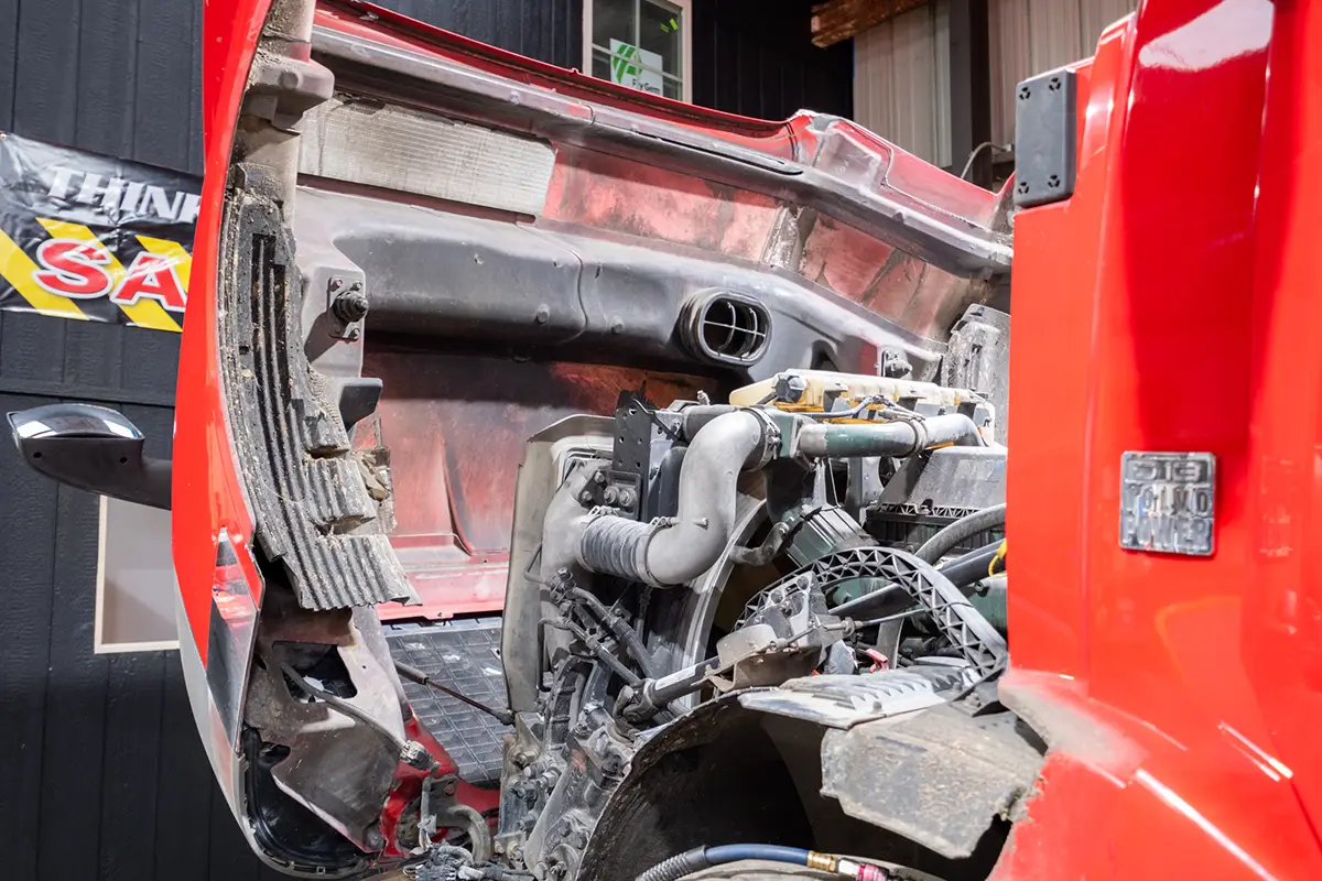 Diesel mechanic performing transmission repair on truck in Mississippi