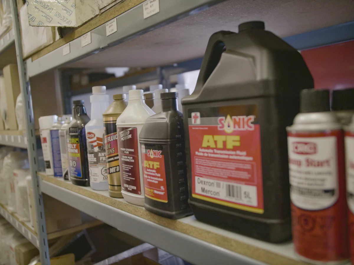 Diesel mechanic performing express lube service on semi truck