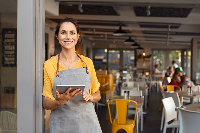 restaurant owner welcoming people