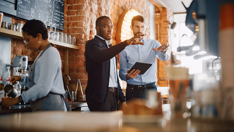 restaurant owner discussing strategies to lower COGS