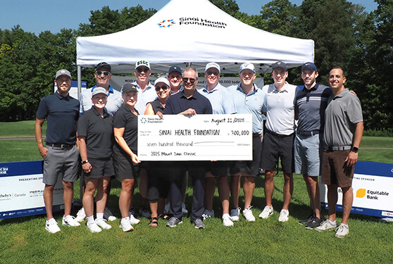A group in golf active wear presents a $100,000 donation to the Sinai Health Foundation