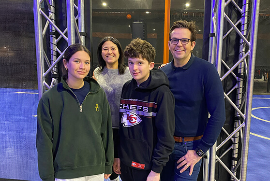 Happy family posing in an indoor activity center