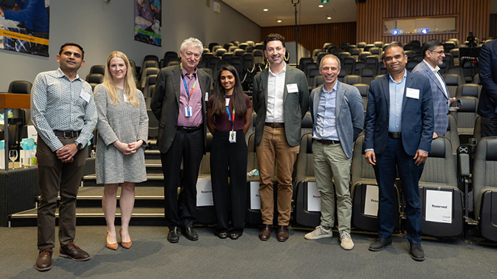 A group of individuals gathered in an auditorium