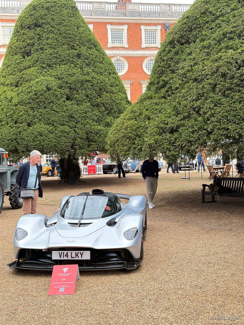 A silver 2024 Aston Martin Valkyrie Spider seen head-on on the gravel.