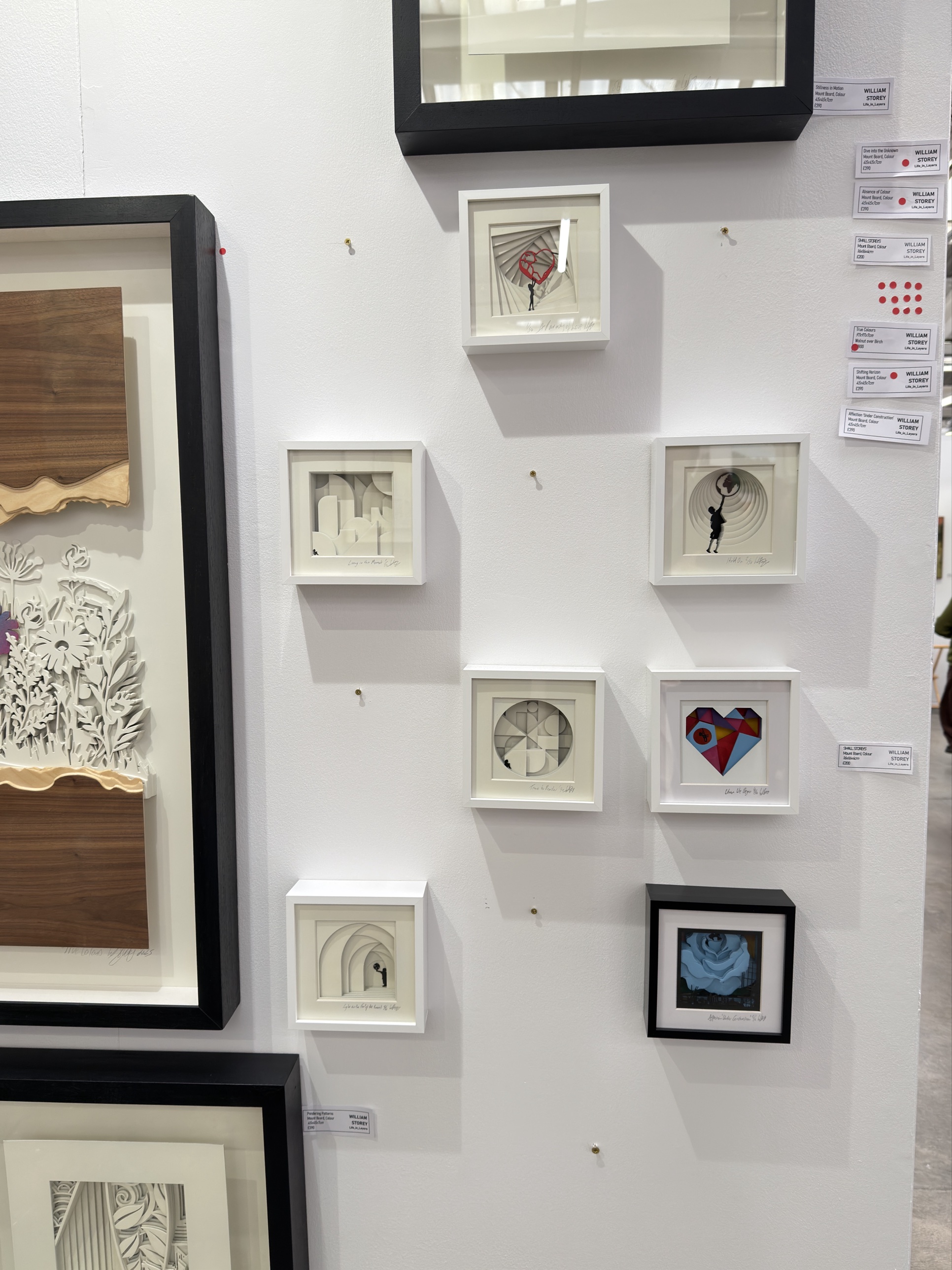 Layered paper-cut works in small box frames