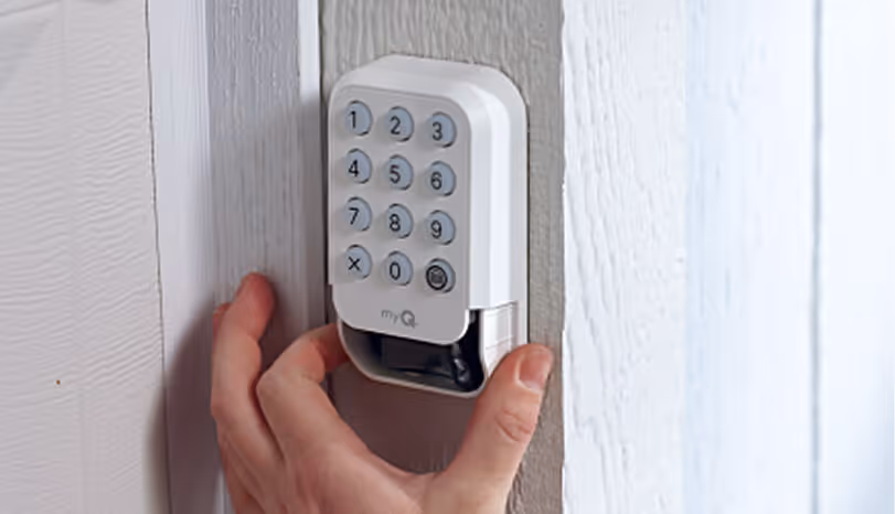 Exterior access control installed on garage door frame