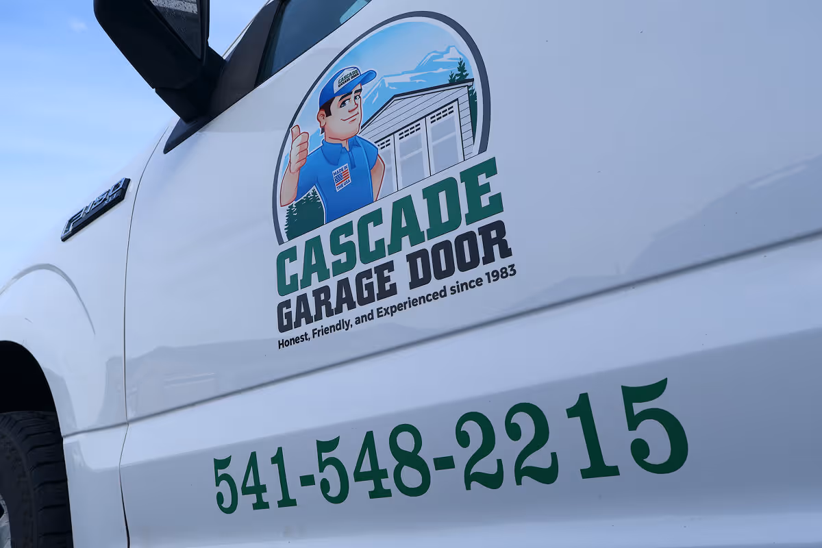 Utility truck door with Cascade Garage Door logo and phone number