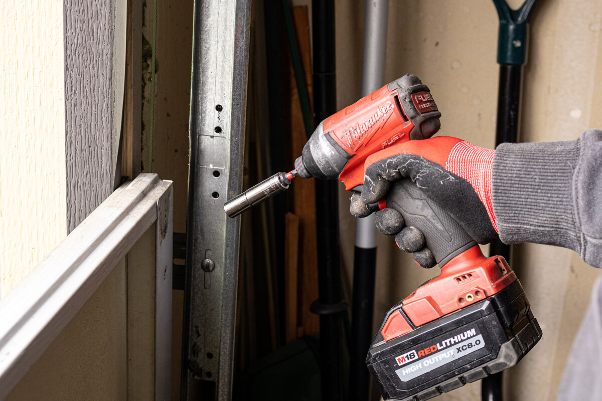 Impact tool used to remove garage door panels