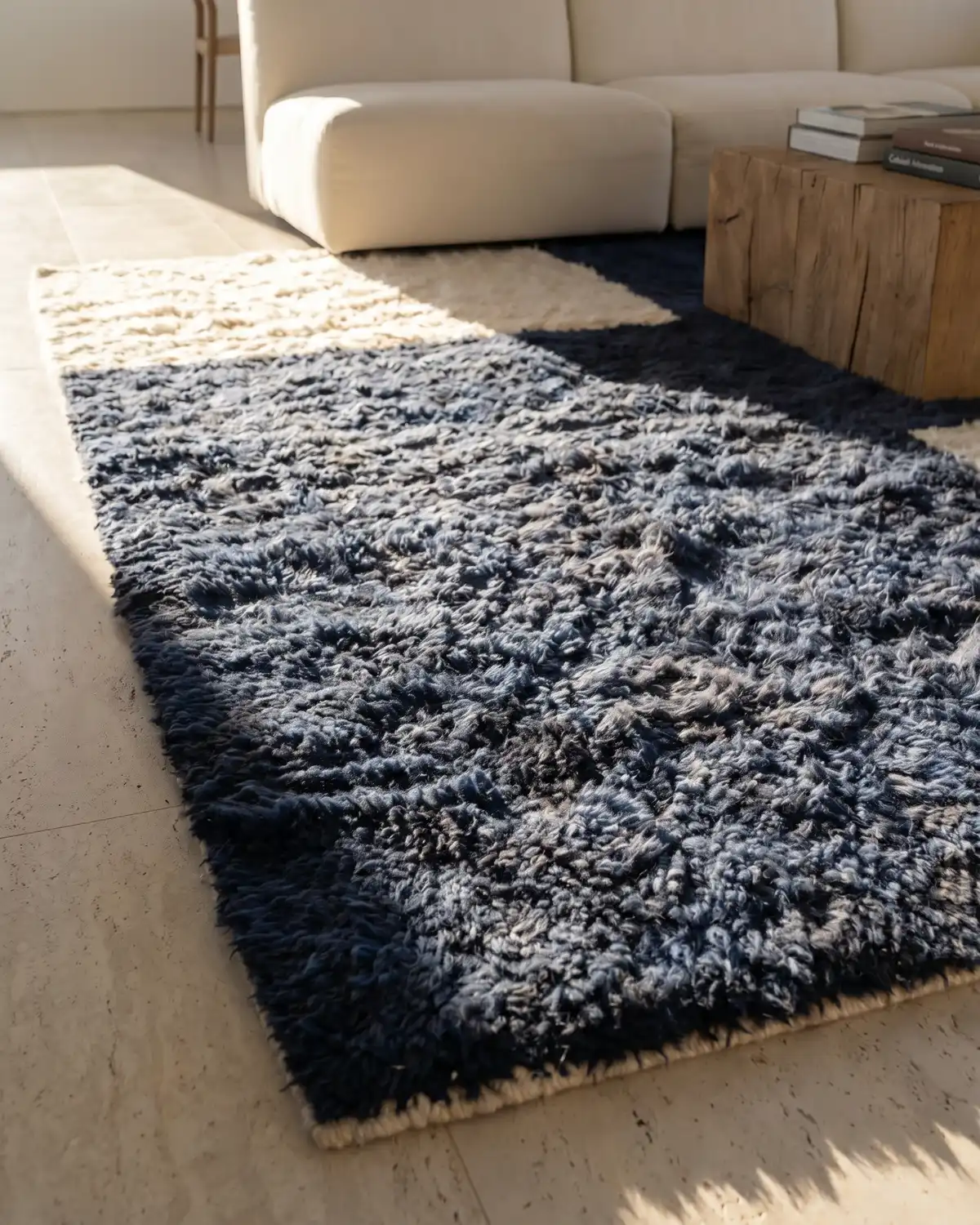 Lunama navy blue Moroccan rug – ground-level close-up of dense blue wool texture in a minimalist living room