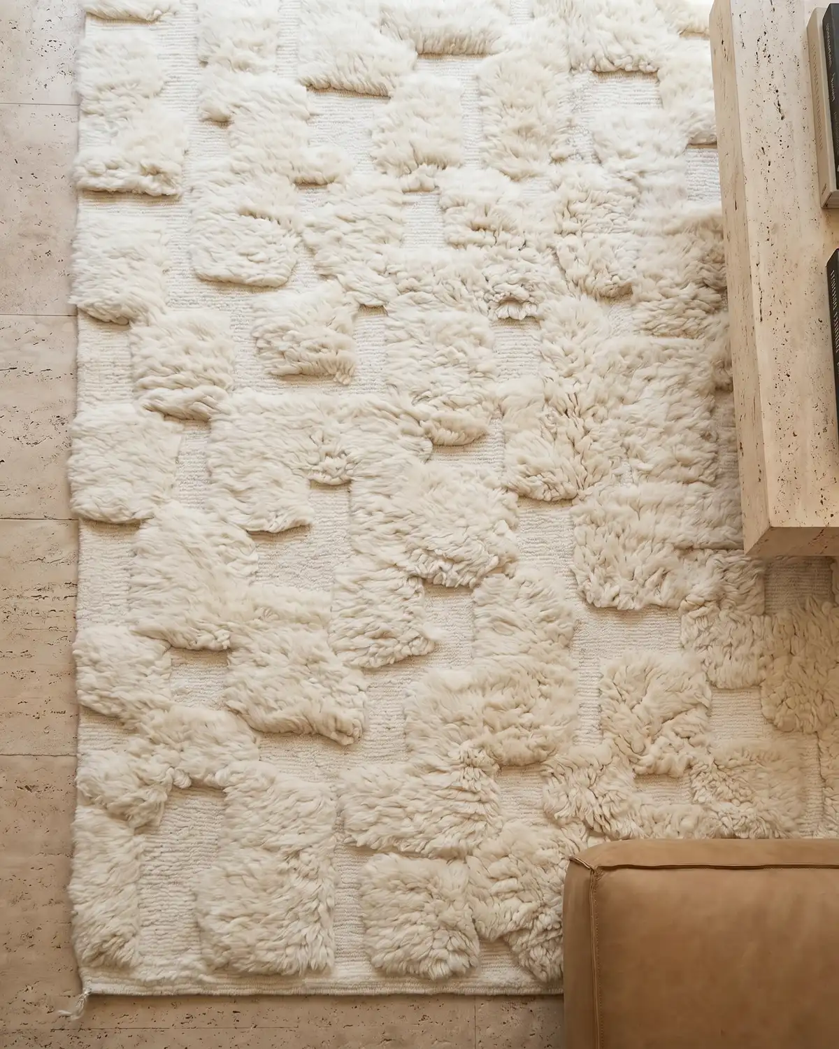 Philippine shaggy square-pattern Moroccan rug – overhead view of sculptural ivory wool texture on travertine floor