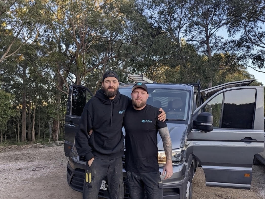 Business owner Seb wearing SEMA Air & Electrical merchandise hat in the work truck