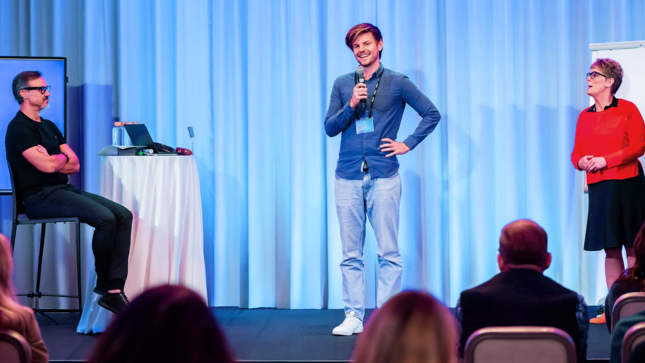 Jakob speaking on stage_