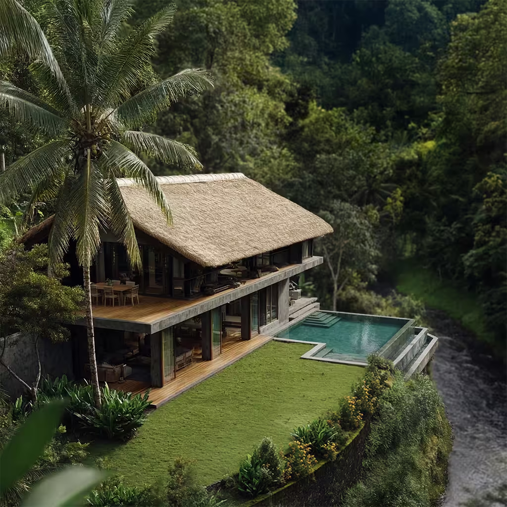 Modern two-story house with a thatched roof surrounded by lush greenery next to a flowing river.