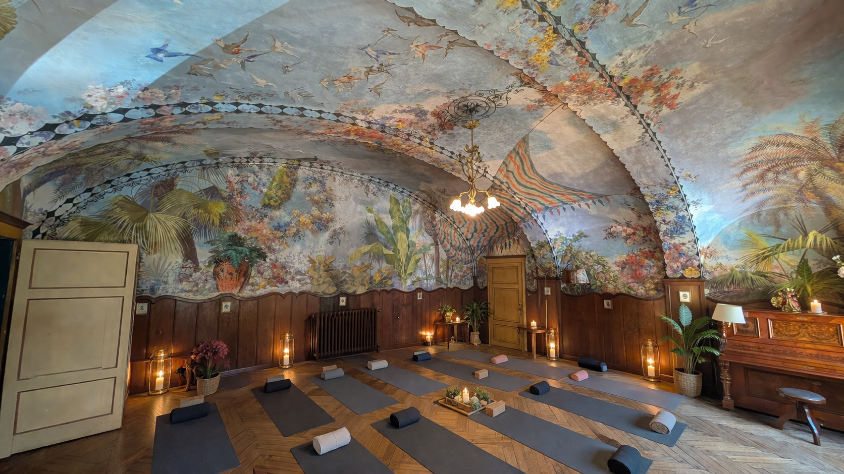 Historic indoor yoga and Pilates studio with frescoed ceilings at Castello Higo, a luxury retreat center in Tuscany, Italy