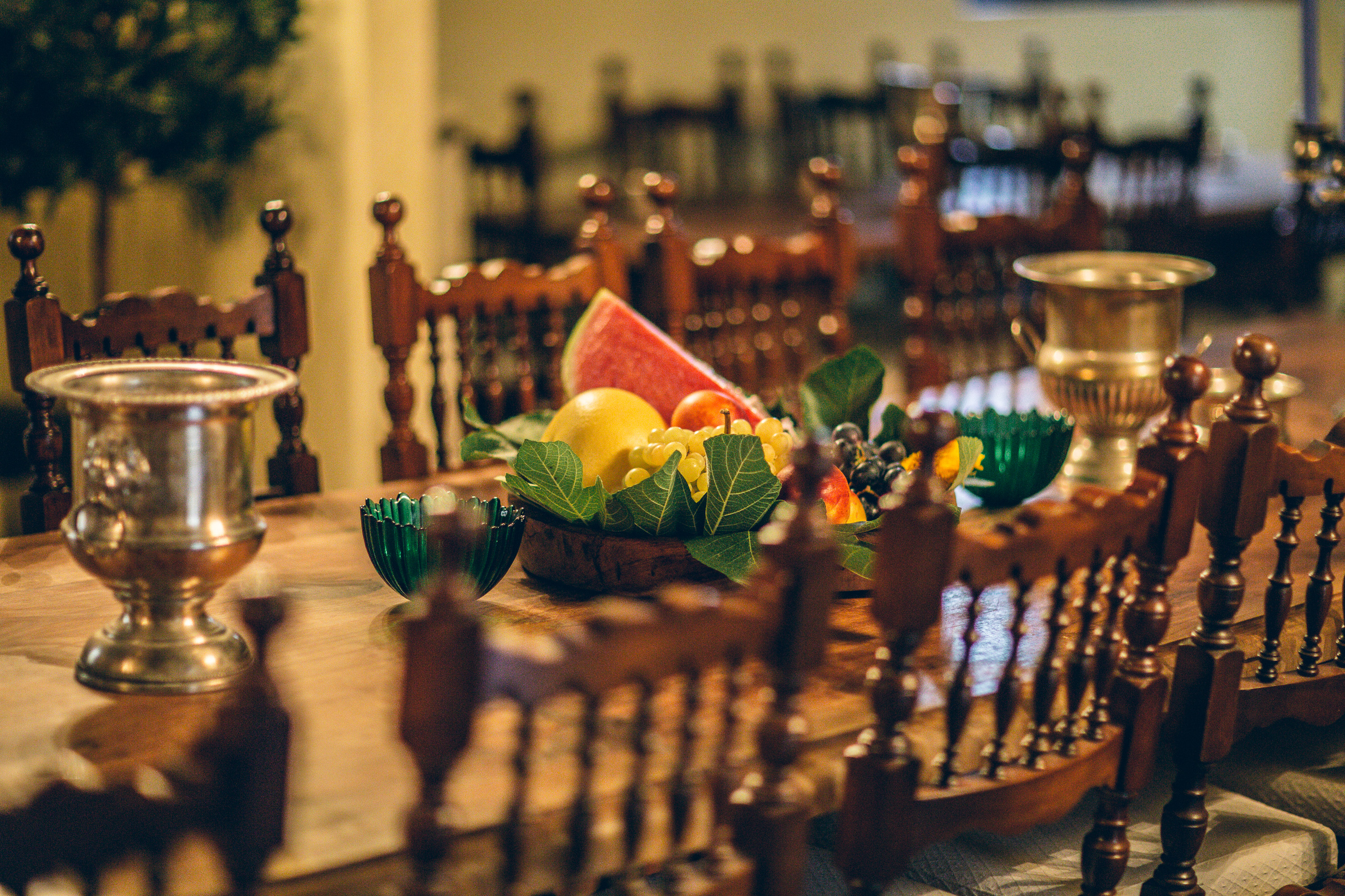 Rustic Tuscan dining table with fresh fruit and traditional interior at Castello Higo, a luxury yoga and Pilates retreat center in Tuscany, Italy