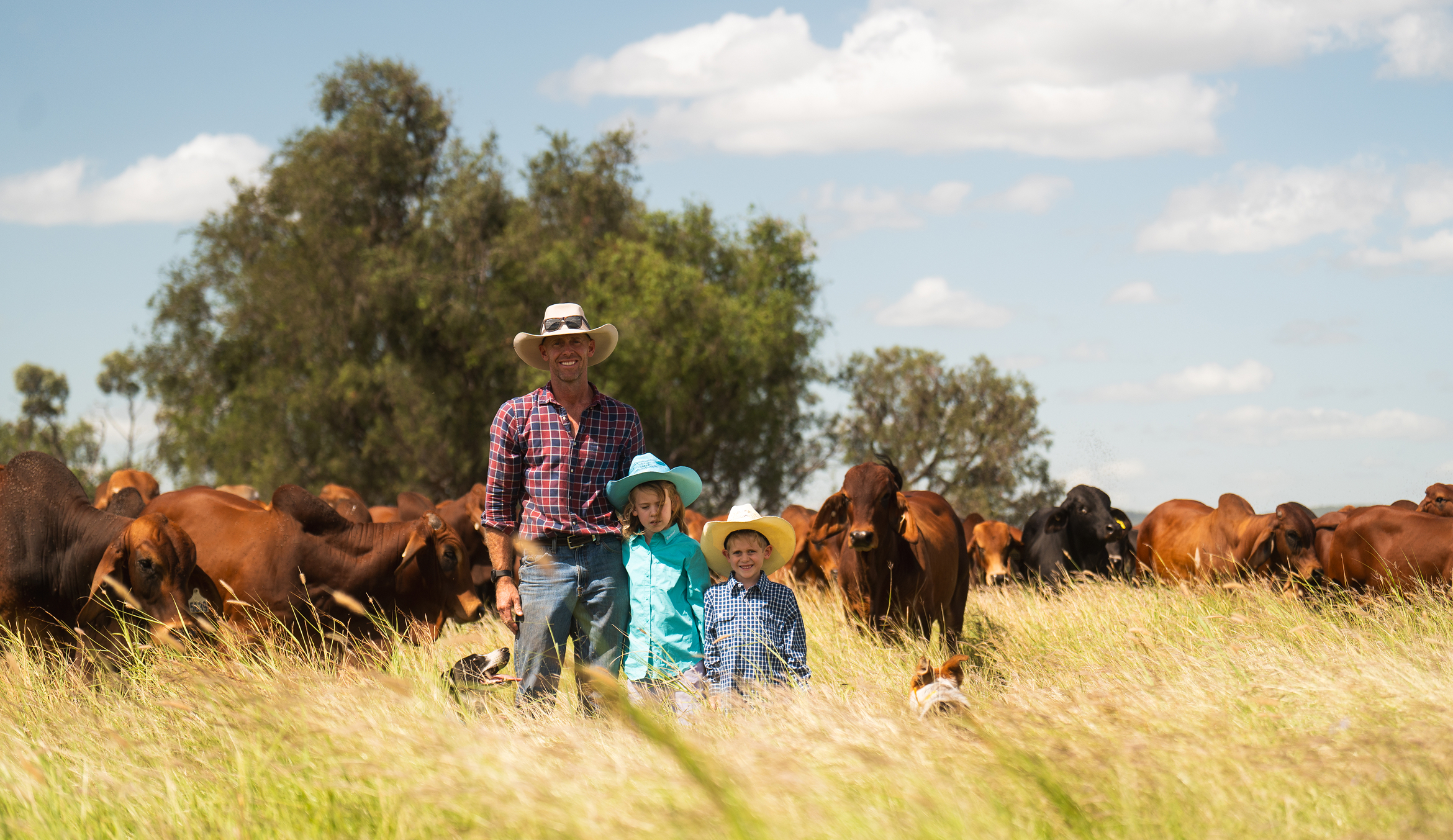The owner of Tarramba stands in a field with his children