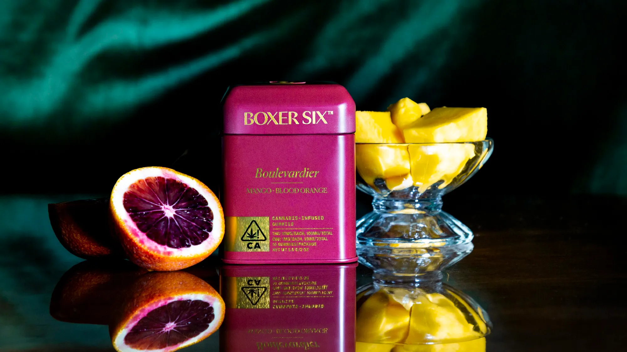 Boxer Six Boulevardier tin with blood orange halves and mango