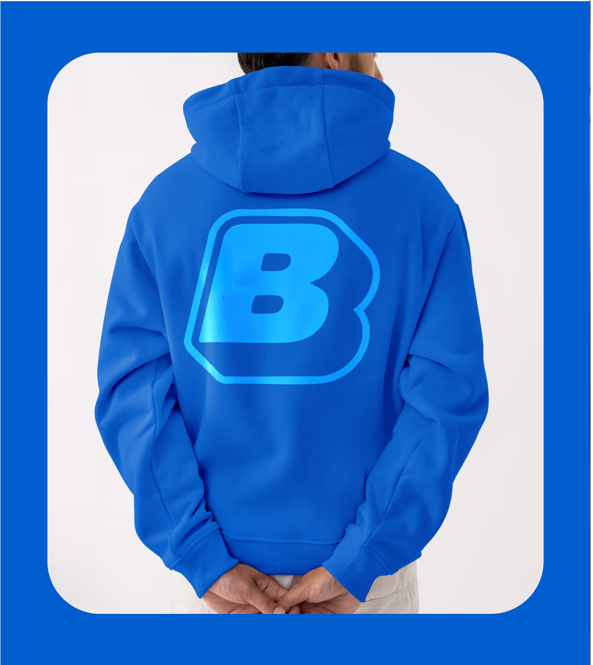 Person in a blue hoodie with a large light-blue puffy 'B' logo printed across the back.