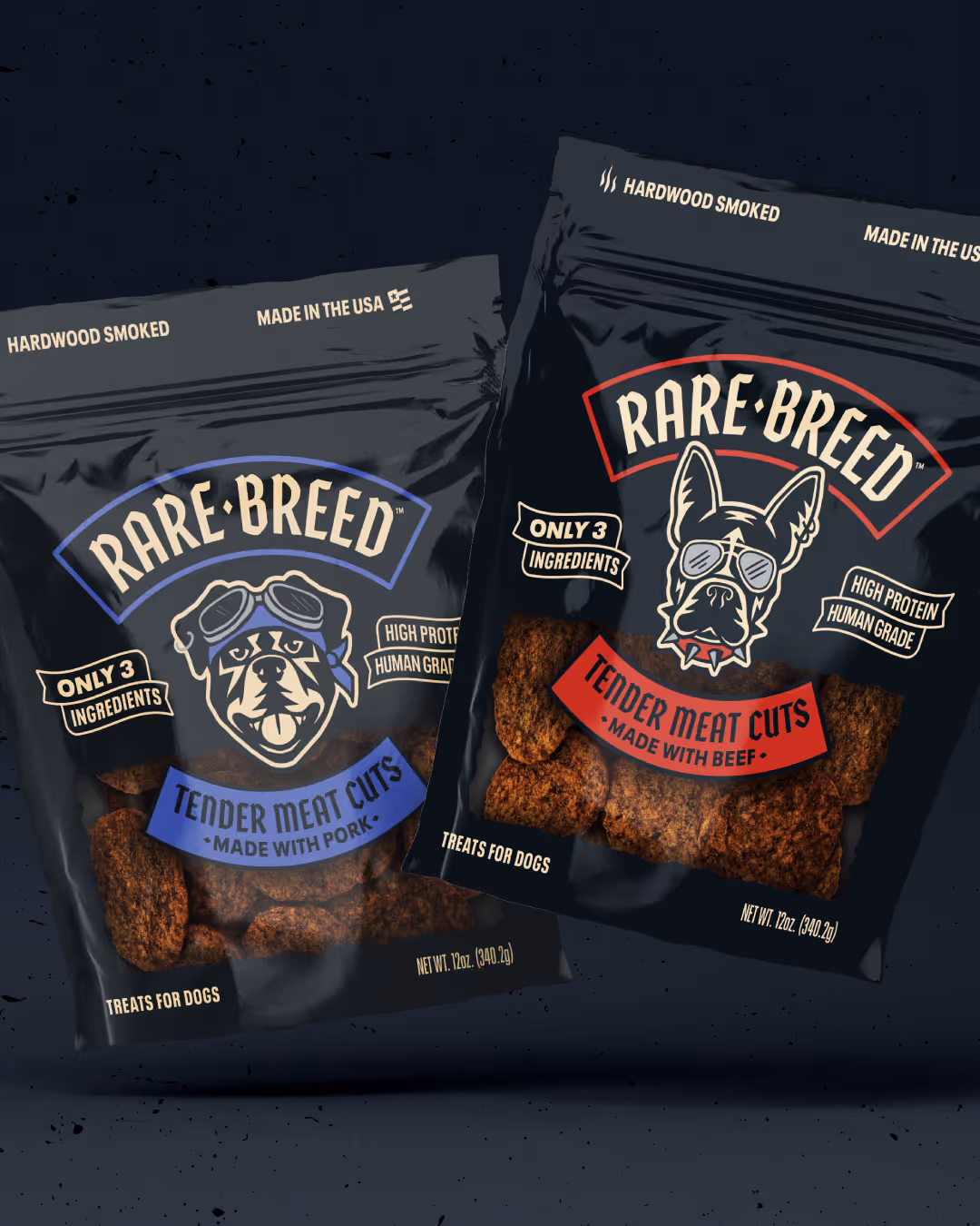 Two black Rare Breed treat pouches: blue 'Made With Pork' bulldog label and red 'Made With Beef' Frenchie label.