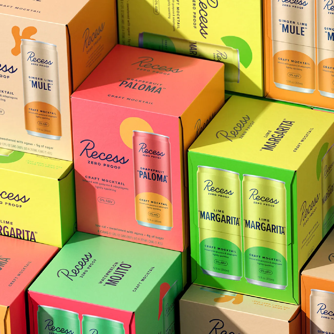 Close-up stack of Recess Zero Proof Paloma and Mule multipack cartons with cans visible through the packaging windows.