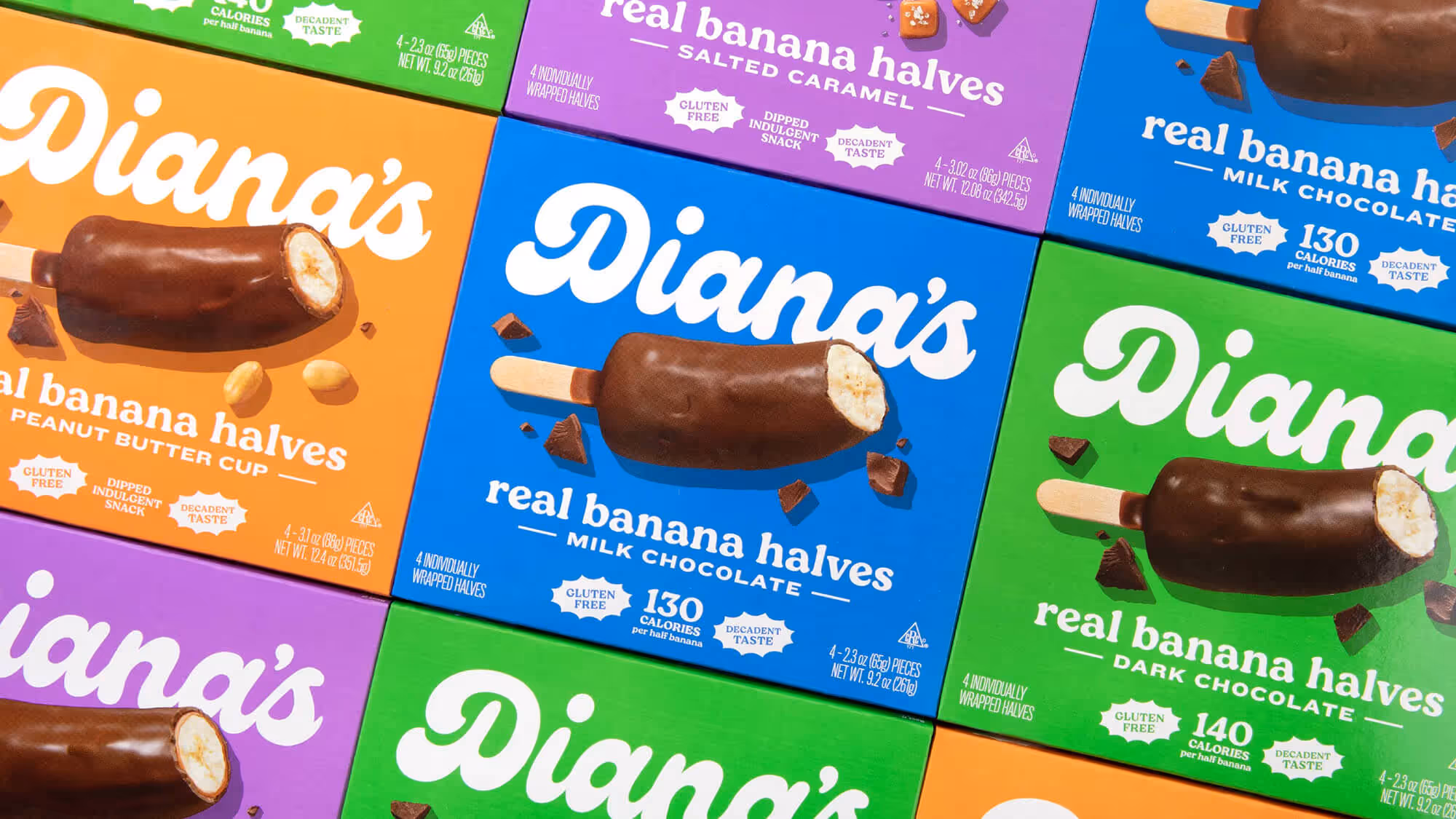 Diana's chocolate-dipped frozen banana boxes in orange, blue, purple, and green flavor variants.