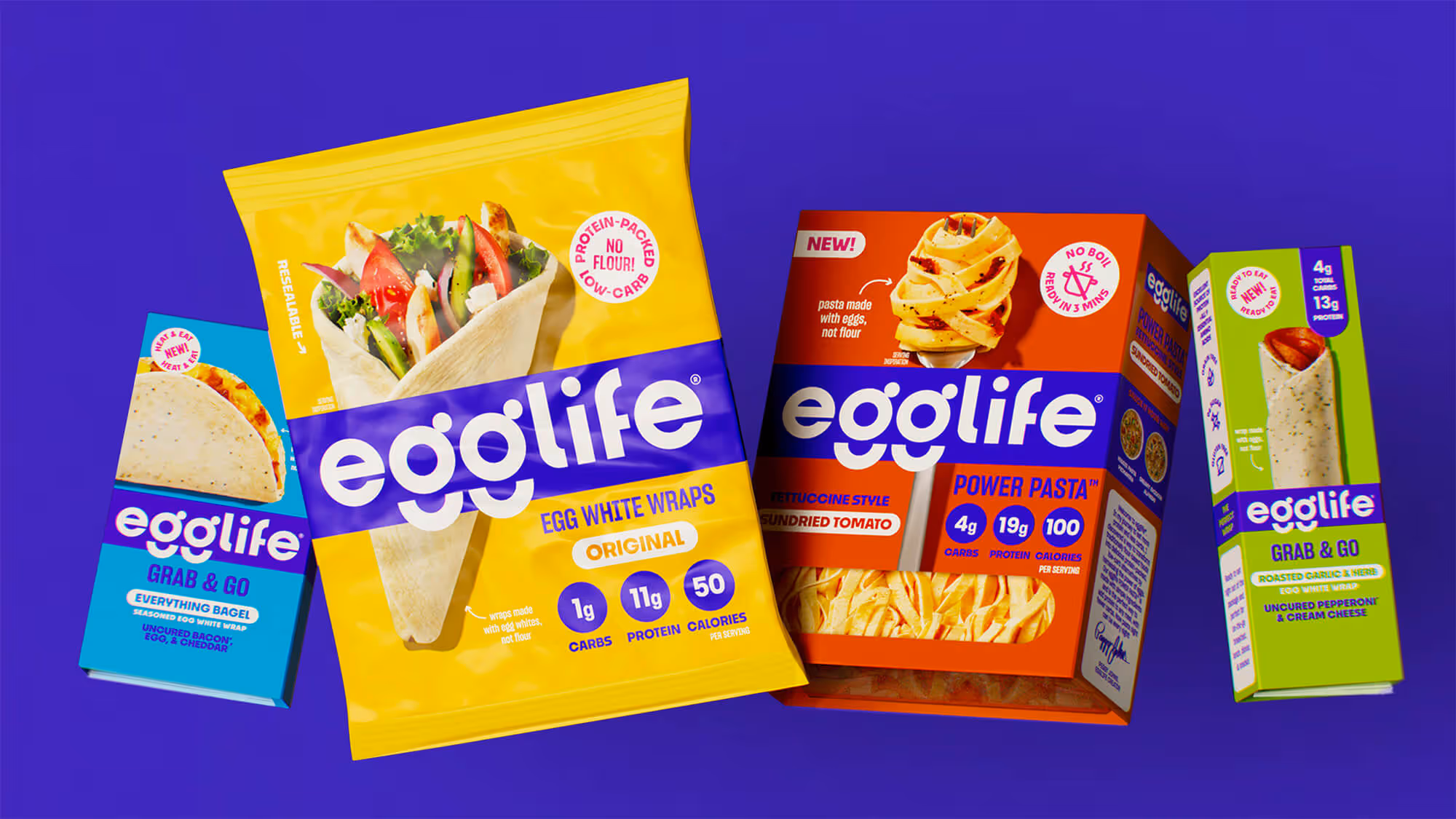 Four egglife packs: blue Everything Bagel, yellow Original Wraps, red Power Pasta Sundried Tomato, green Smashed Pepperoni.