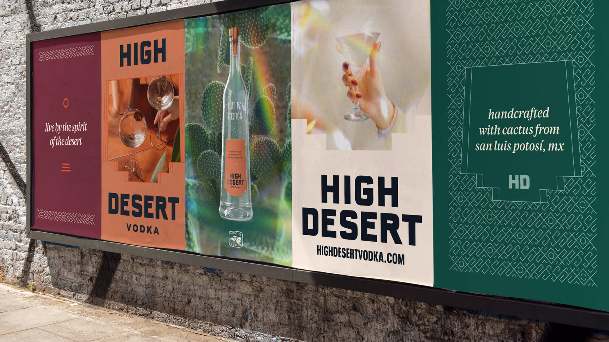 Wheatpasted wall of five High Desert posters: 'Live by the spirit of the desert,' wordmark, bottle, and cactus art.